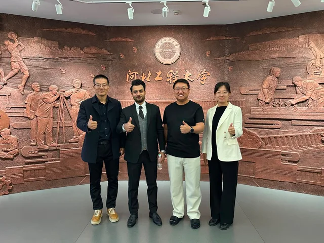 UM International leadership with university officials in China